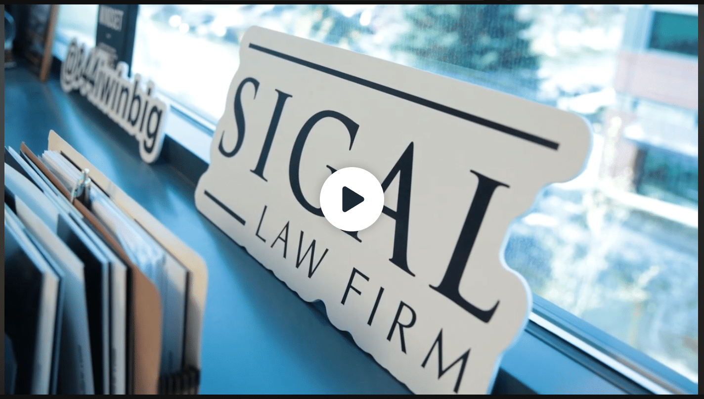 Sign displaying 'SIGAL LAW FIRM' positioned near a window, with a video play button overlay.